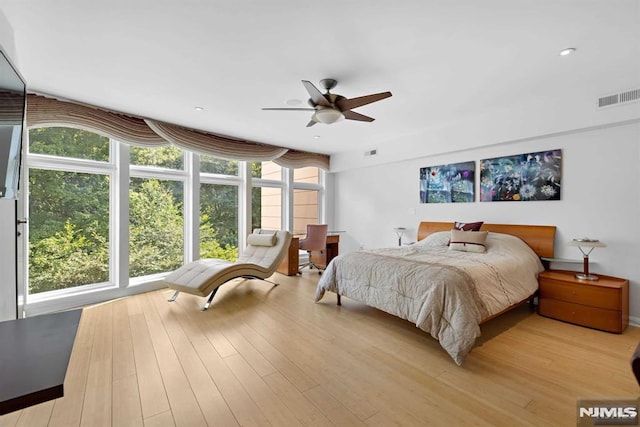 bedroom featuring ceiling fan and light hardwood / wood-style floors