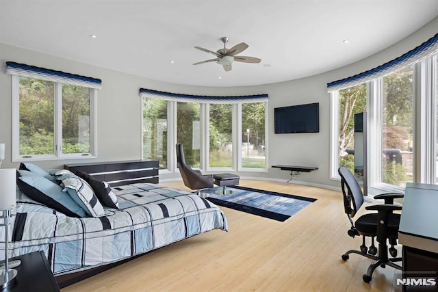 bedroom featuring ceiling fan and hardwood / wood-style floors