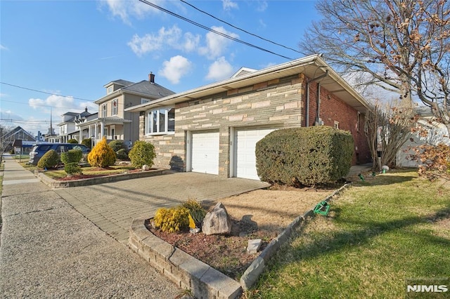 view of property exterior featuring a garage and a yard