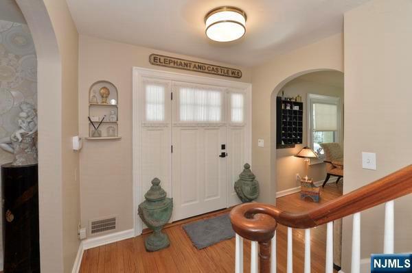 entryway with hardwood / wood-style flooring