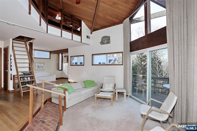 living room with high vaulted ceiling, wooden ceiling, wood finished floors, visible vents, and beamed ceiling