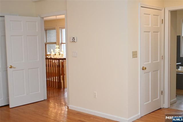 hallway with light wood-type flooring