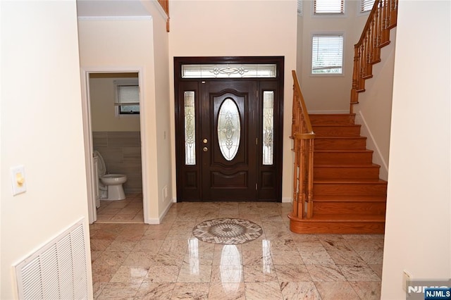 entrance foyer featuring a high ceiling