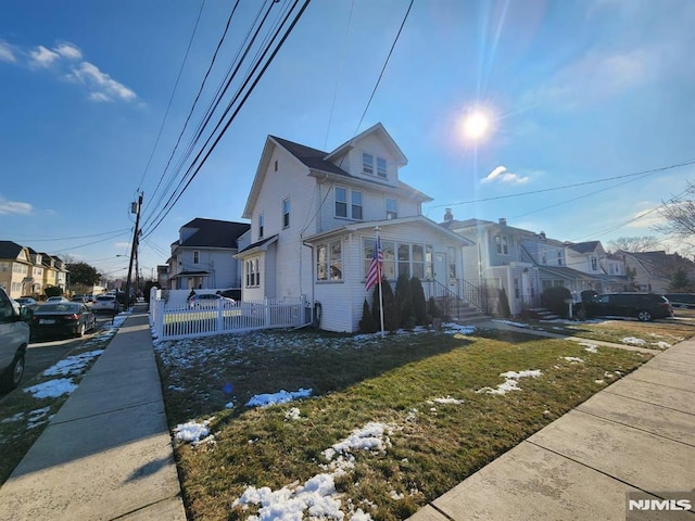 view of side of home with a lawn