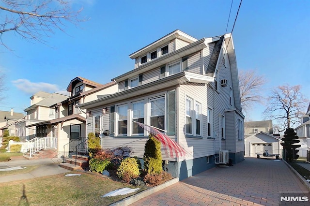 view of front of house featuring an outdoor structure and a garage