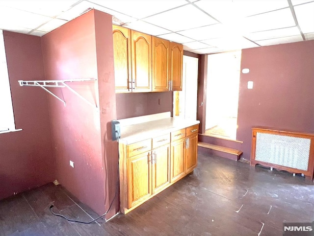 laundry room with radiator