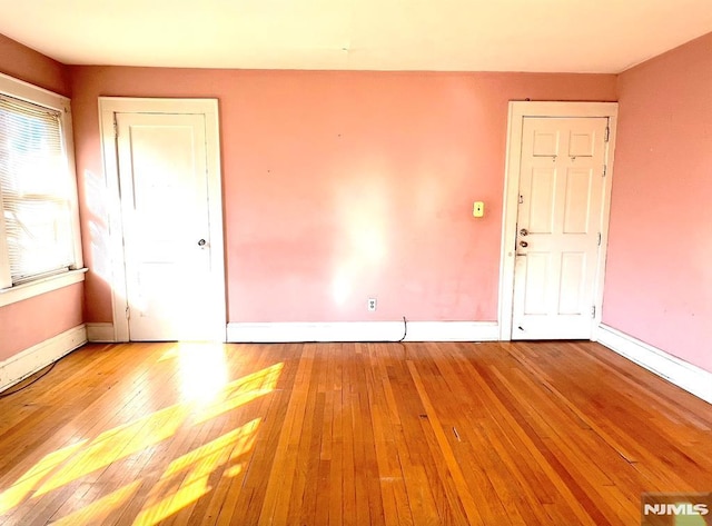 spare room featuring light hardwood / wood-style floors