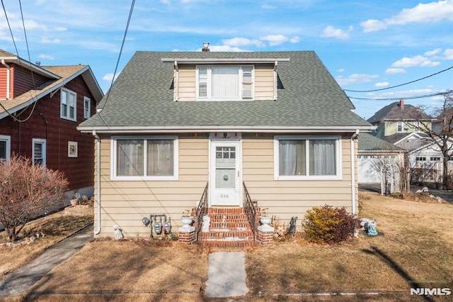 bungalow featuring a front yard