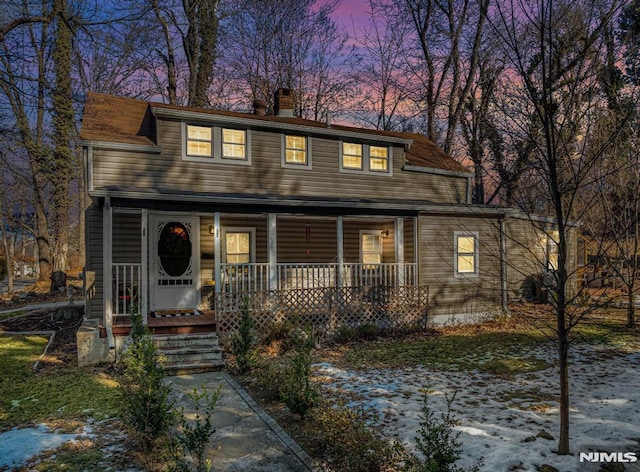 view of front of property featuring covered porch