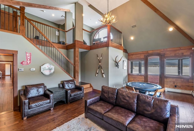 living room featuring an inviting chandelier, hardwood / wood-style flooring, a baseboard radiator, and high vaulted ceiling