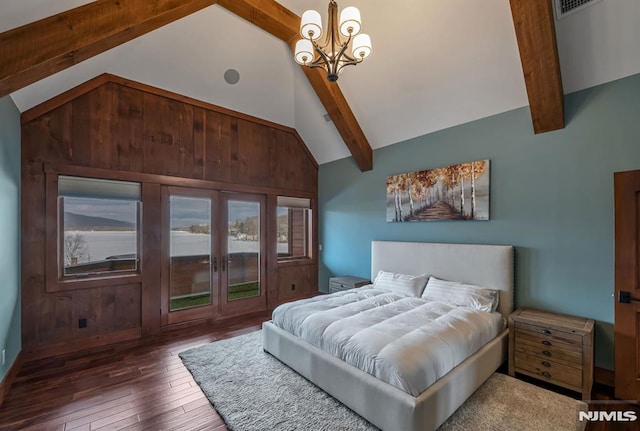 bedroom with dark hardwood / wood-style floors, wood walls, beam ceiling, high vaulted ceiling, and a chandelier