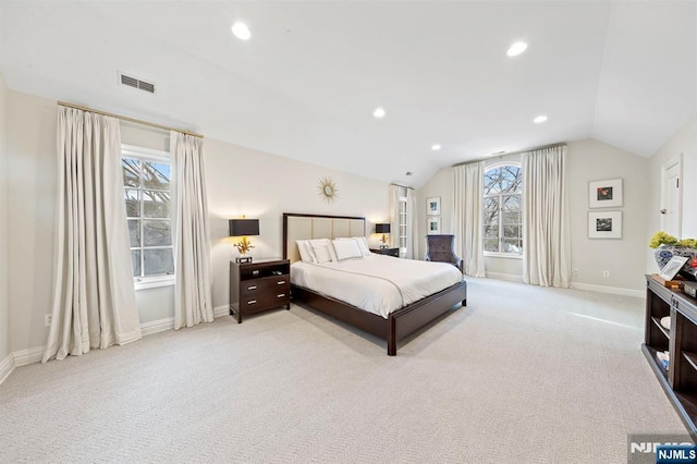 carpeted bedroom with vaulted ceiling