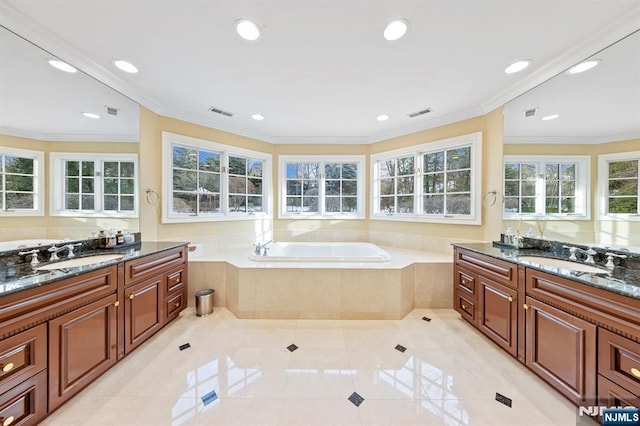 bathroom with vanity, tile patterned flooring, a relaxing tiled tub, and ornamental molding