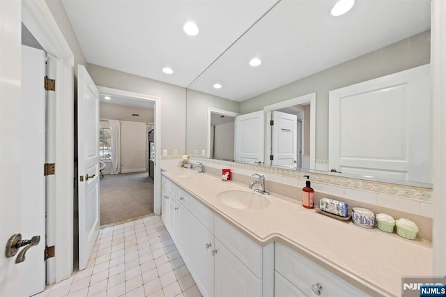 bathroom with vanity and tile patterned flooring