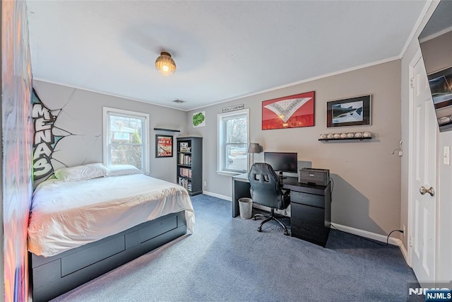 carpeted bedroom featuring multiple windows and ornamental molding