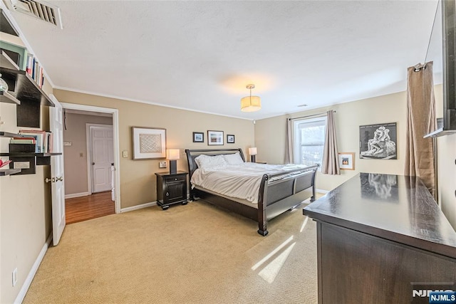 bedroom featuring light carpet