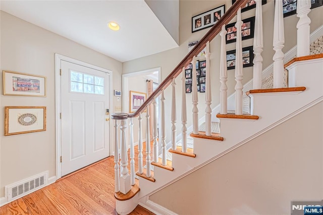 entrance foyer featuring hardwood / wood-style floors