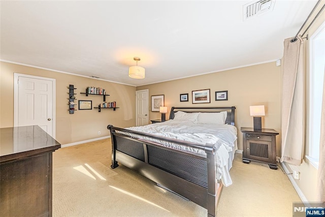 carpeted bedroom with ornamental molding