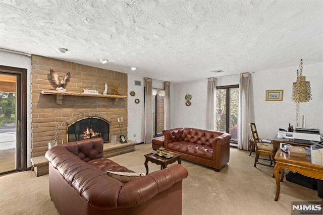 carpeted living room with a brick fireplace, a healthy amount of sunlight, and a textured ceiling