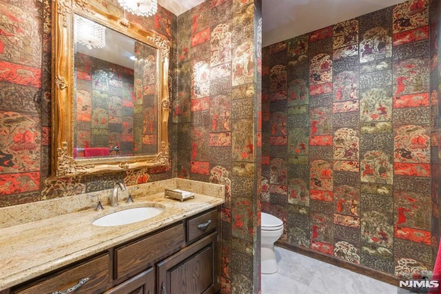 bathroom featuring toilet and vanity