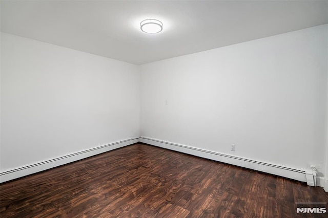 empty room featuring dark hardwood / wood-style flooring