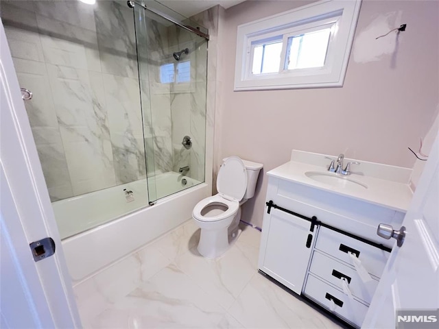 full bathroom featuring bath / shower combo with glass door, toilet, and vanity