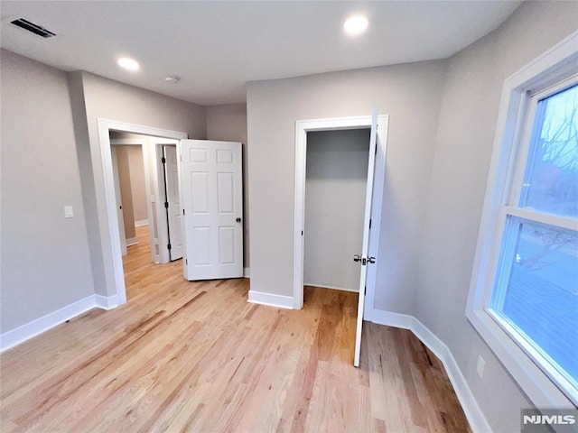 unfurnished bedroom with light hardwood / wood-style floors