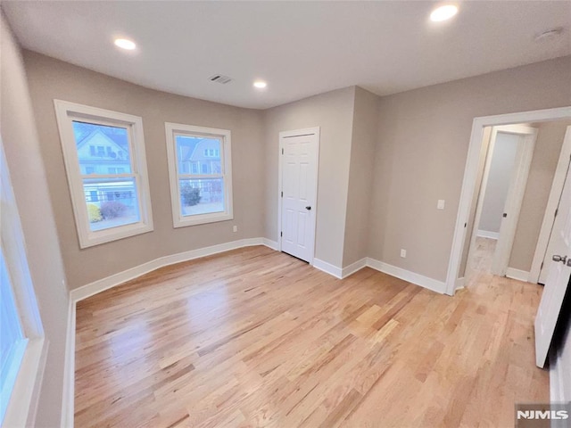 unfurnished bedroom with light hardwood / wood-style floors