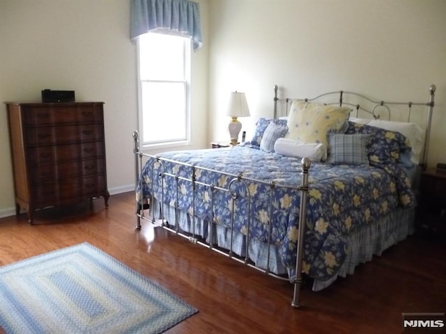 bedroom with wood-type flooring