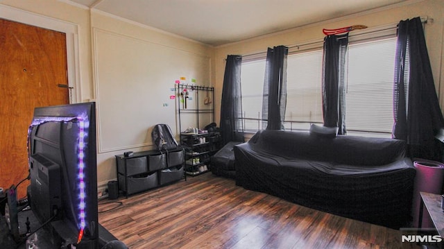 bedroom featuring dark hardwood / wood-style flooring and ornamental molding