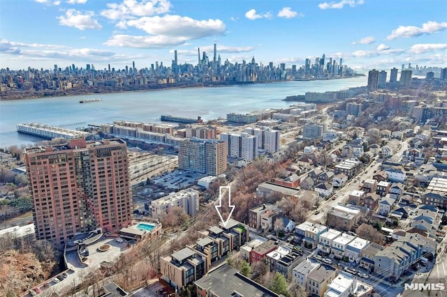 birds eye view of property with a water view