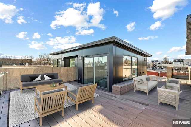 wooden terrace featuring an outdoor living space