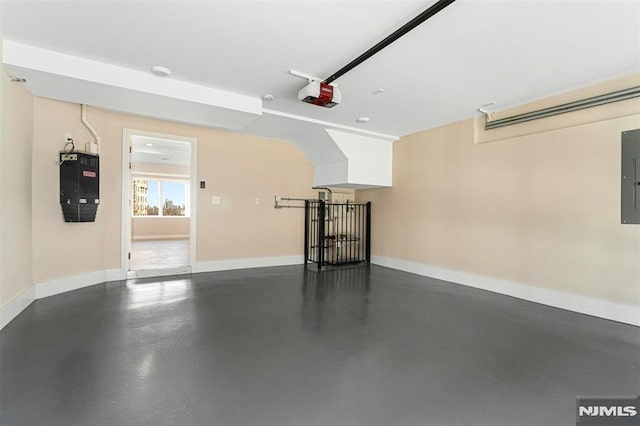 garage featuring a garage door opener and electric panel