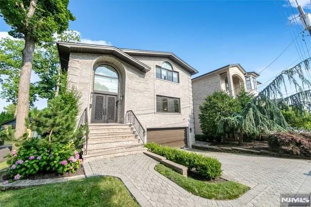 view of front of home with a garage