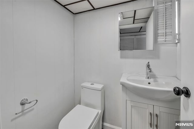 bathroom with toilet and vanity