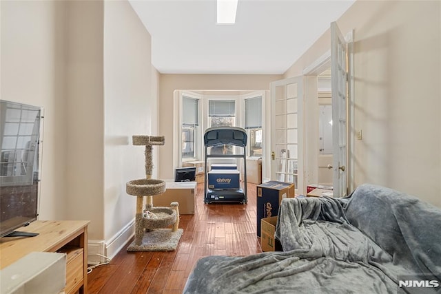 living area with dark hardwood / wood-style floors