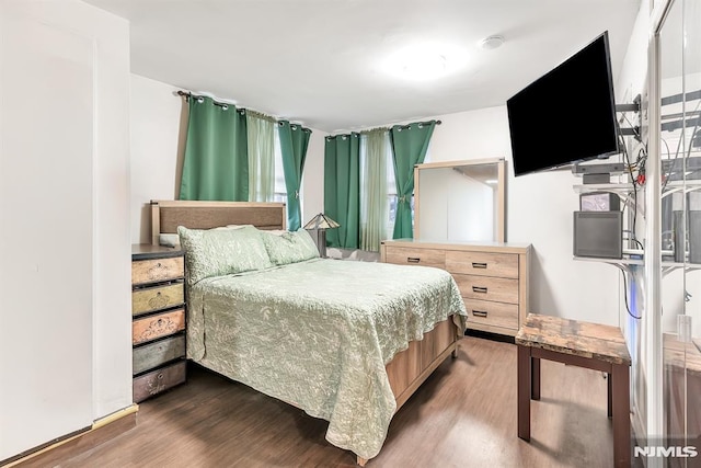 bedroom featuring dark hardwood / wood-style flooring