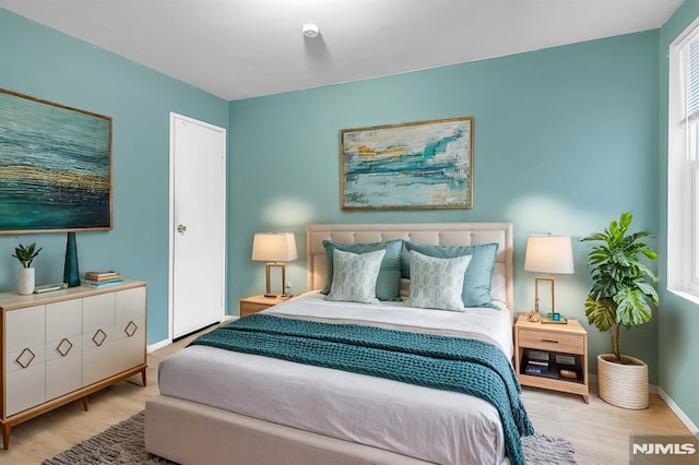 bedroom featuring light hardwood / wood-style floors