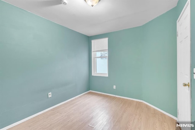 spare room featuring light wood-type flooring