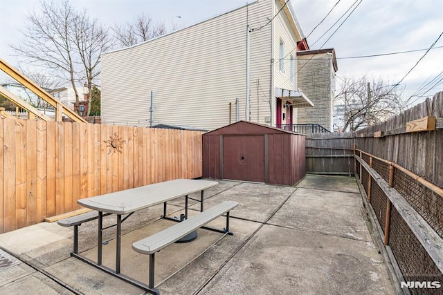 view of patio featuring a storage shed