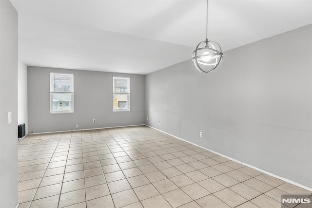 spare room featuring light tile patterned floors