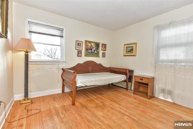 sitting room featuring light hardwood / wood-style floors