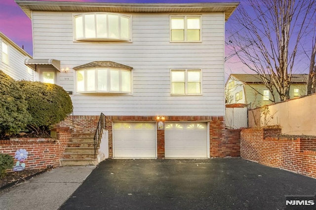 view of front of property featuring a garage