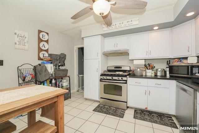 kitchen with ceiling fan, light tile patterned floors, white cabinets, and stainless steel appliances