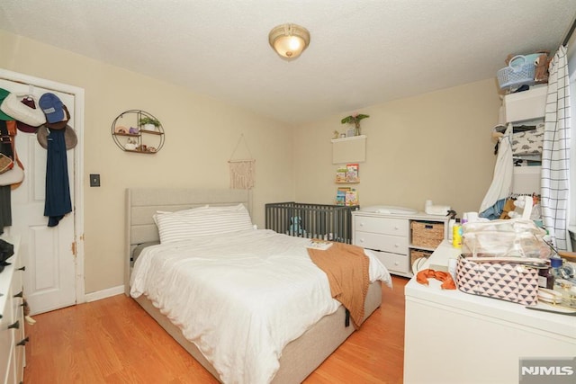 bedroom with light hardwood / wood-style flooring