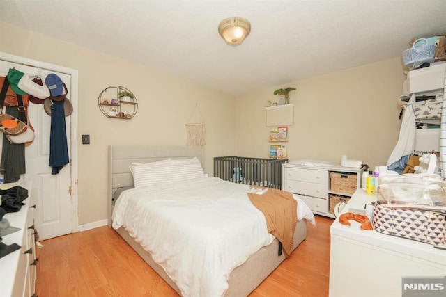 bedroom with light hardwood / wood-style flooring