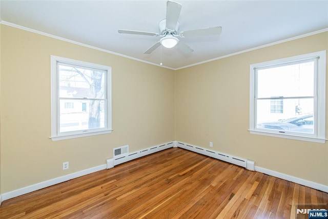 unfurnished room with ceiling fan, crown molding, and light wood-type flooring