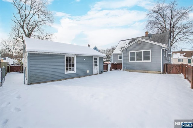 view of snow covered house