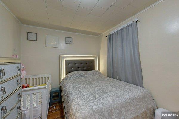 bedroom featuring ornamental molding