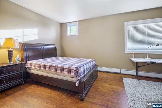 bedroom with lofted ceiling and dark hardwood / wood-style flooring